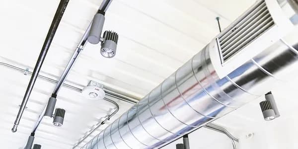Ductwork and vents running along a ceiling